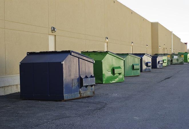 overhead shot of filled construction dumpsters in English